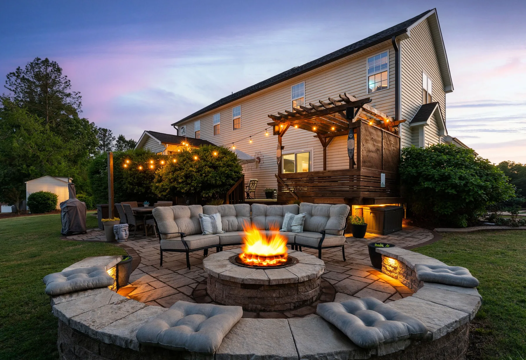 Backyard patio and fire pit photographed at twilight in Clayton, North Carolina