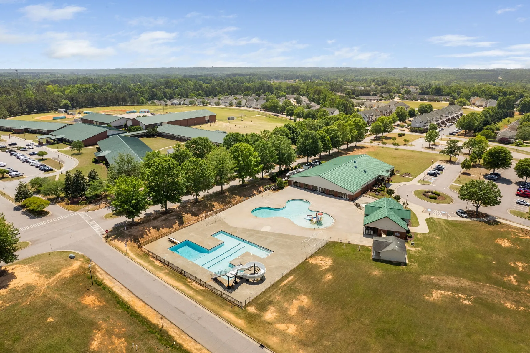 Aerial view of a residential community and pool amenities in Clayton, North Carolina