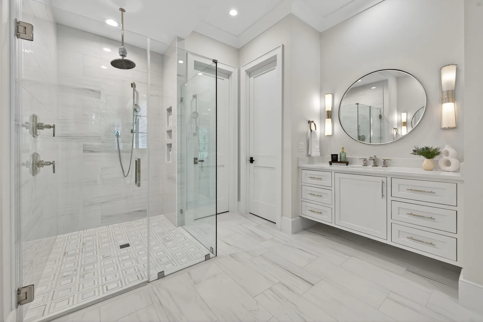 Modern primary bathroom with glass shower and floating vanity in Garner, NC
