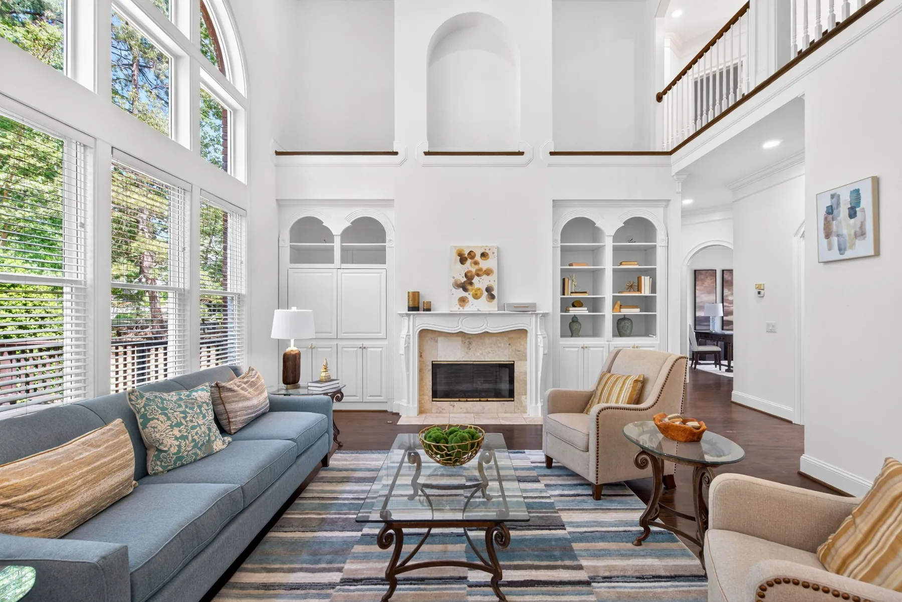 Morrisville, NC living room with two-story windows and fireplace
