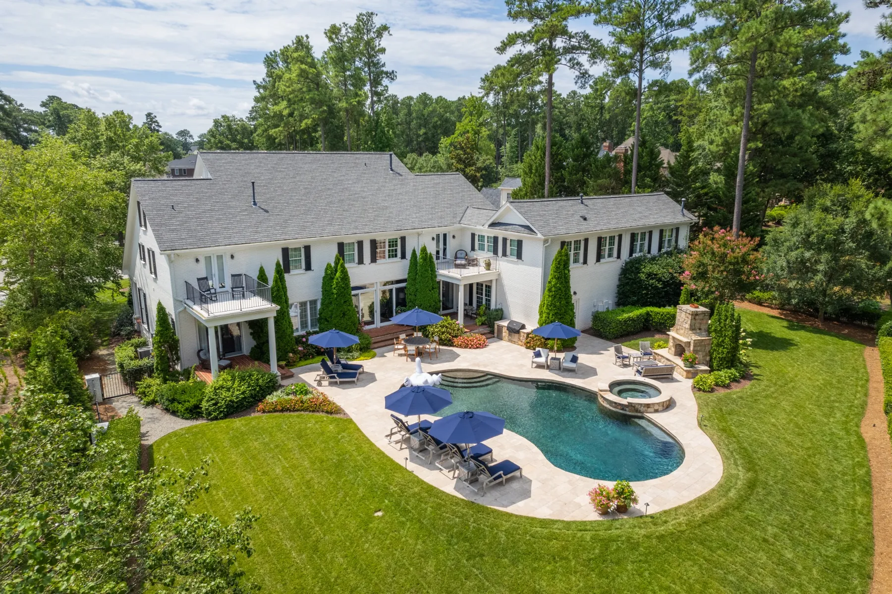 Aerial view of a Morrisville, NC home with pool and landscaped backyard
