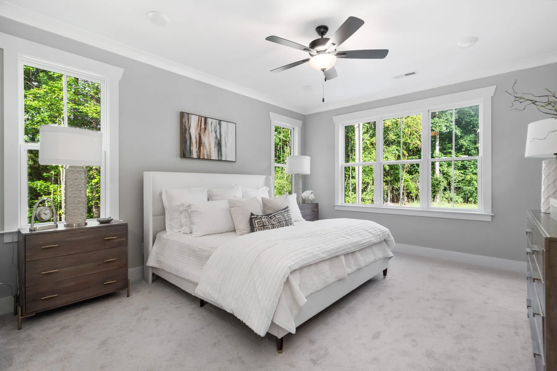 Bright primary bedroom with wooded views in Mebane, NC