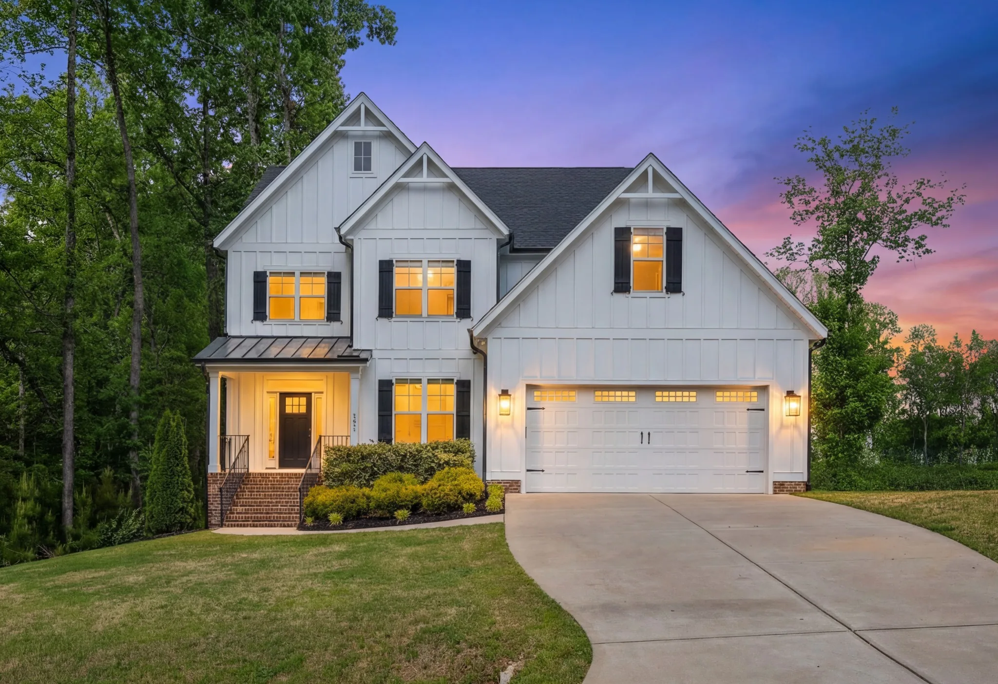 Twilight real estate photo of a modern white home in Smithfield, North Carolina.