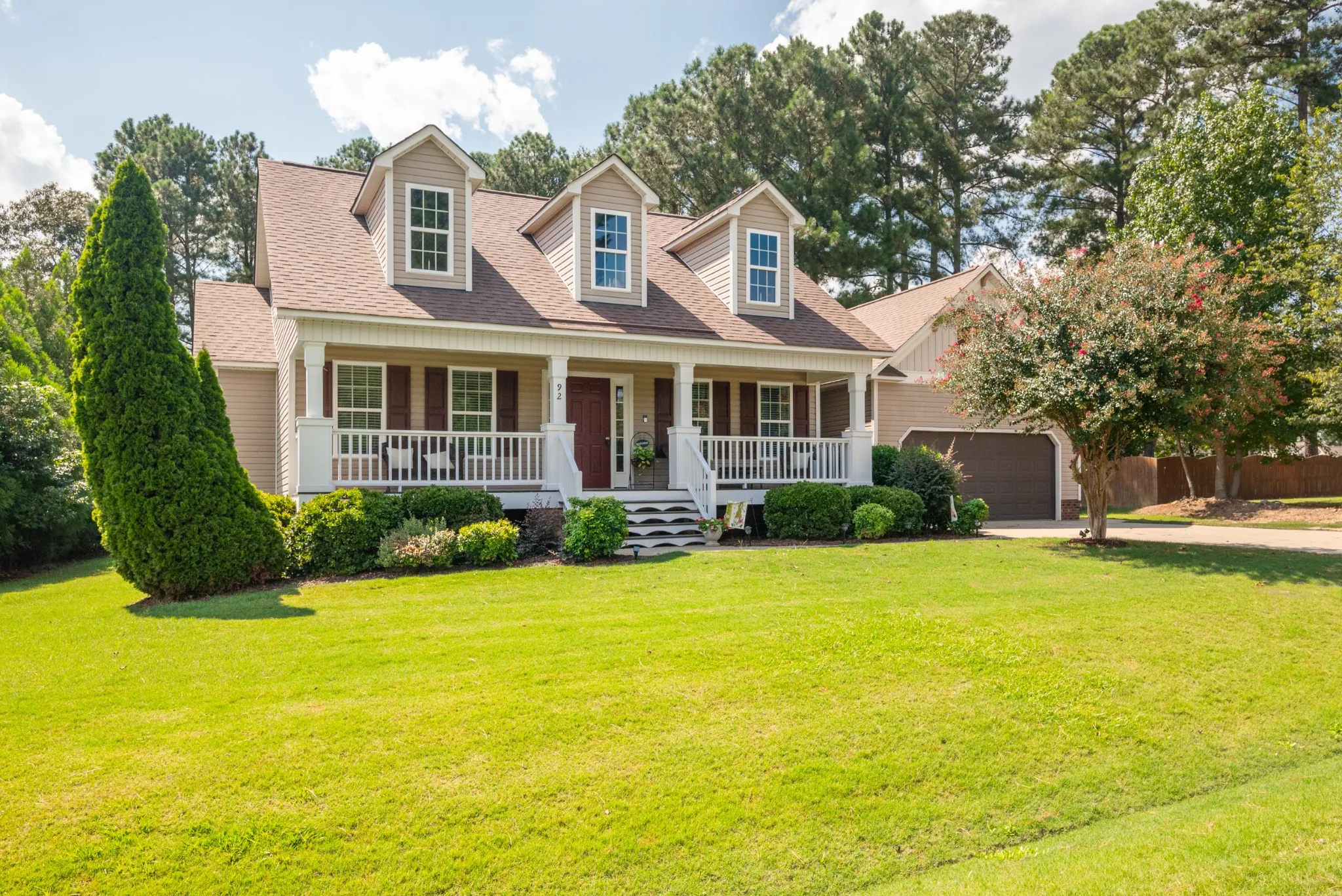 Daytime real estate exterior photo of a traditional home in Smithfield, North Carolina.