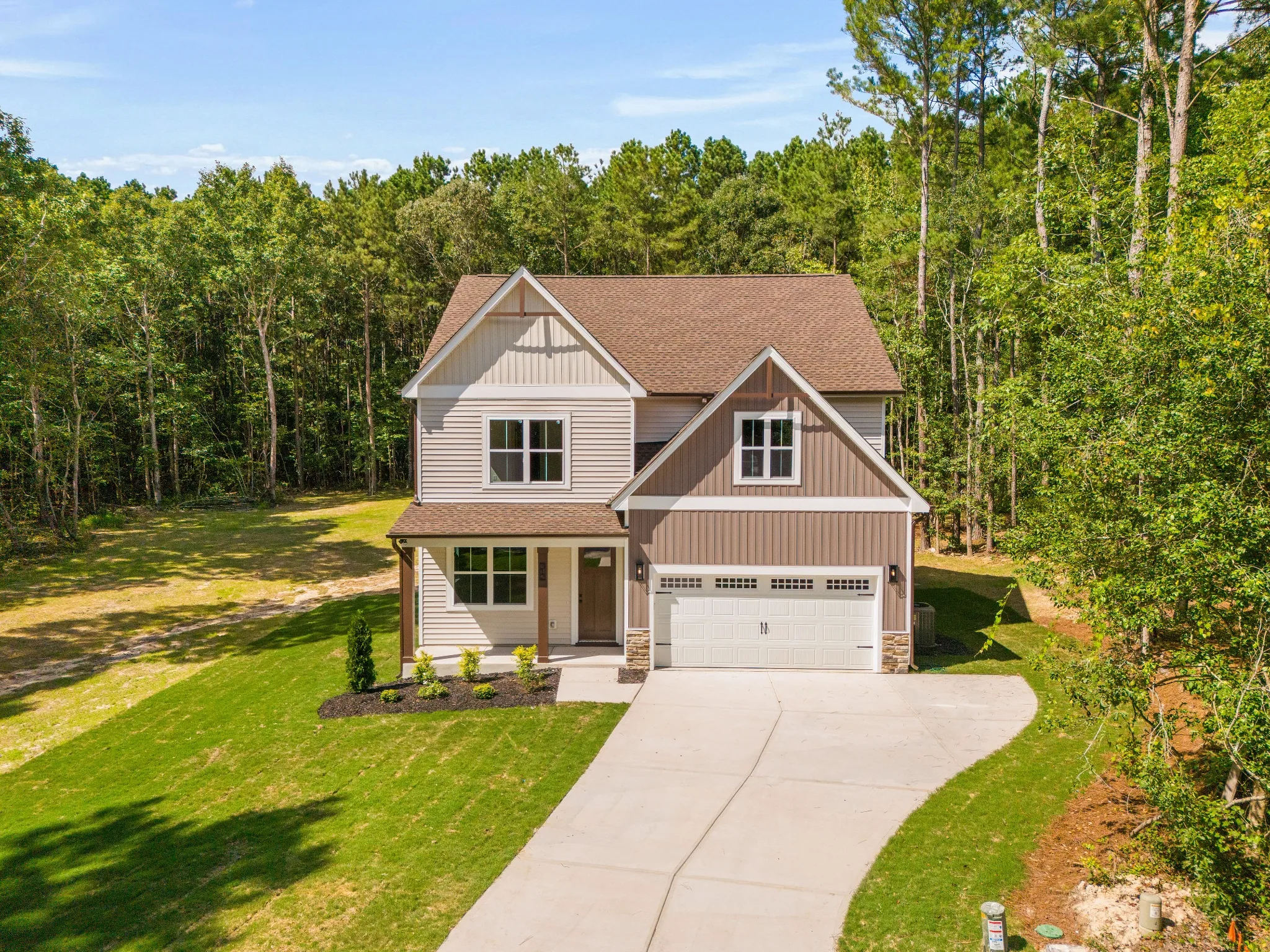 Aerial real estate photo of a home on a wooded lot in Smithfield, North Carolina.