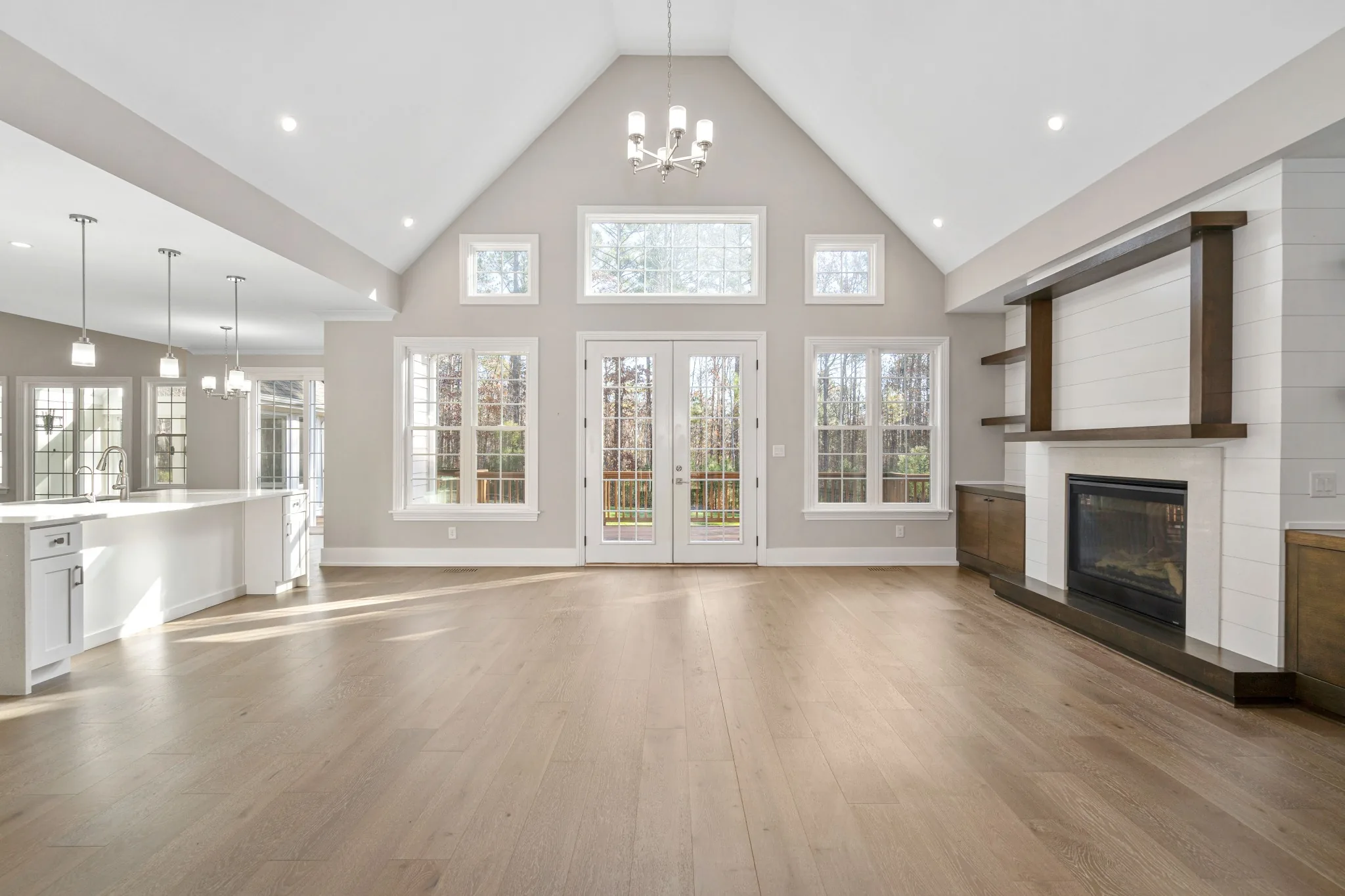 Large open great room with fireplace and vaulted ceiling in Pittsboro, North Carolina.
