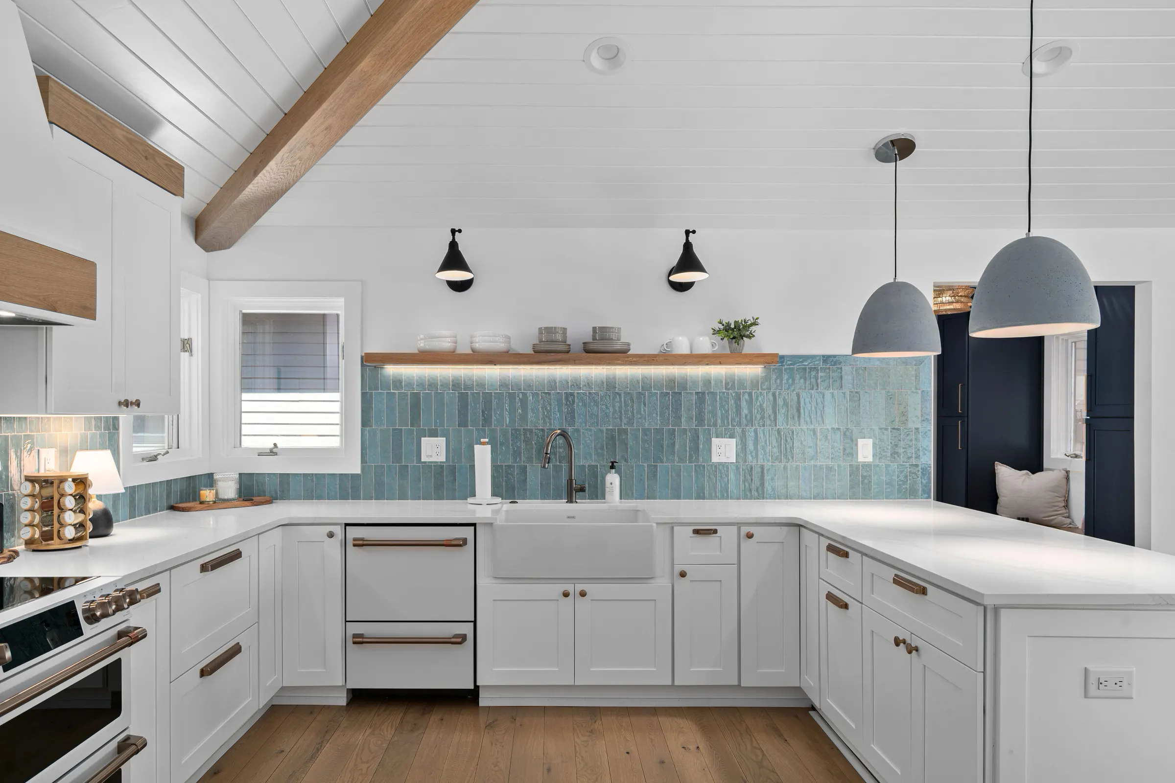 Wendell kitchen with turquoise tile, an apron-front sink, and natural wood accents, photographed by Upper Echelon Visuals
