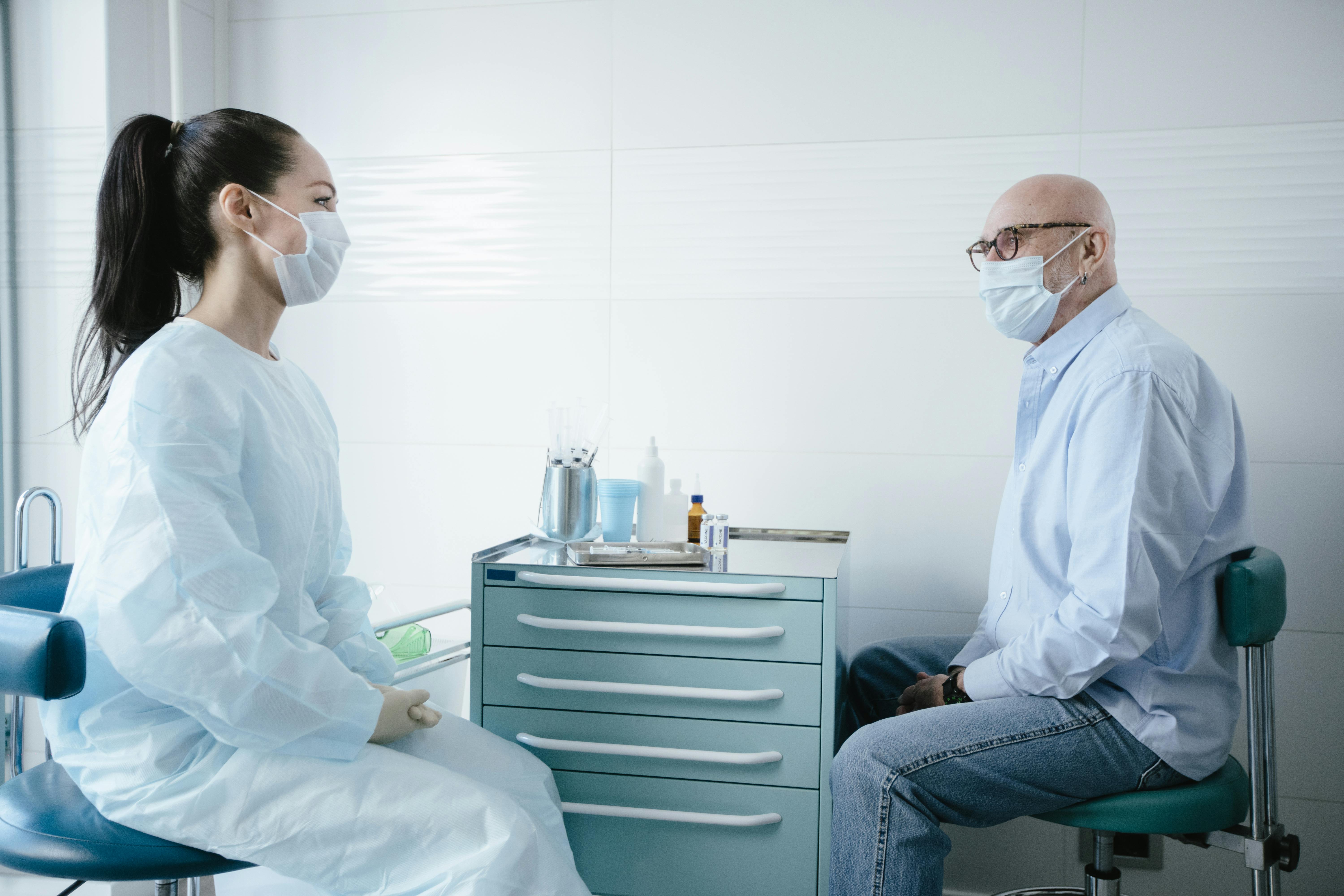 Man consulting with doctor about NAD IV therapy and wellness treatment options