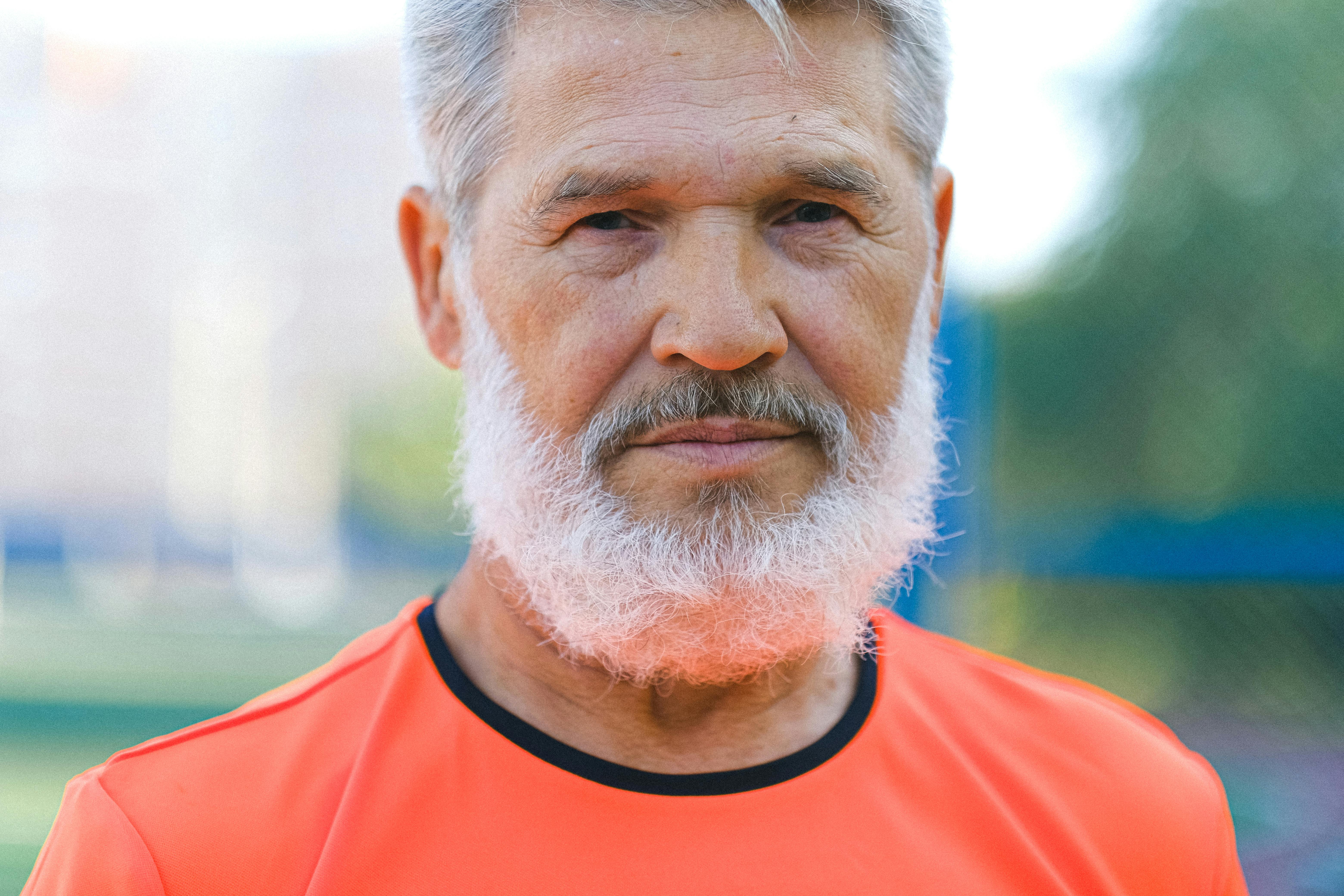 Confident mature man with beard representing healthy male vitality and natural ED reversal