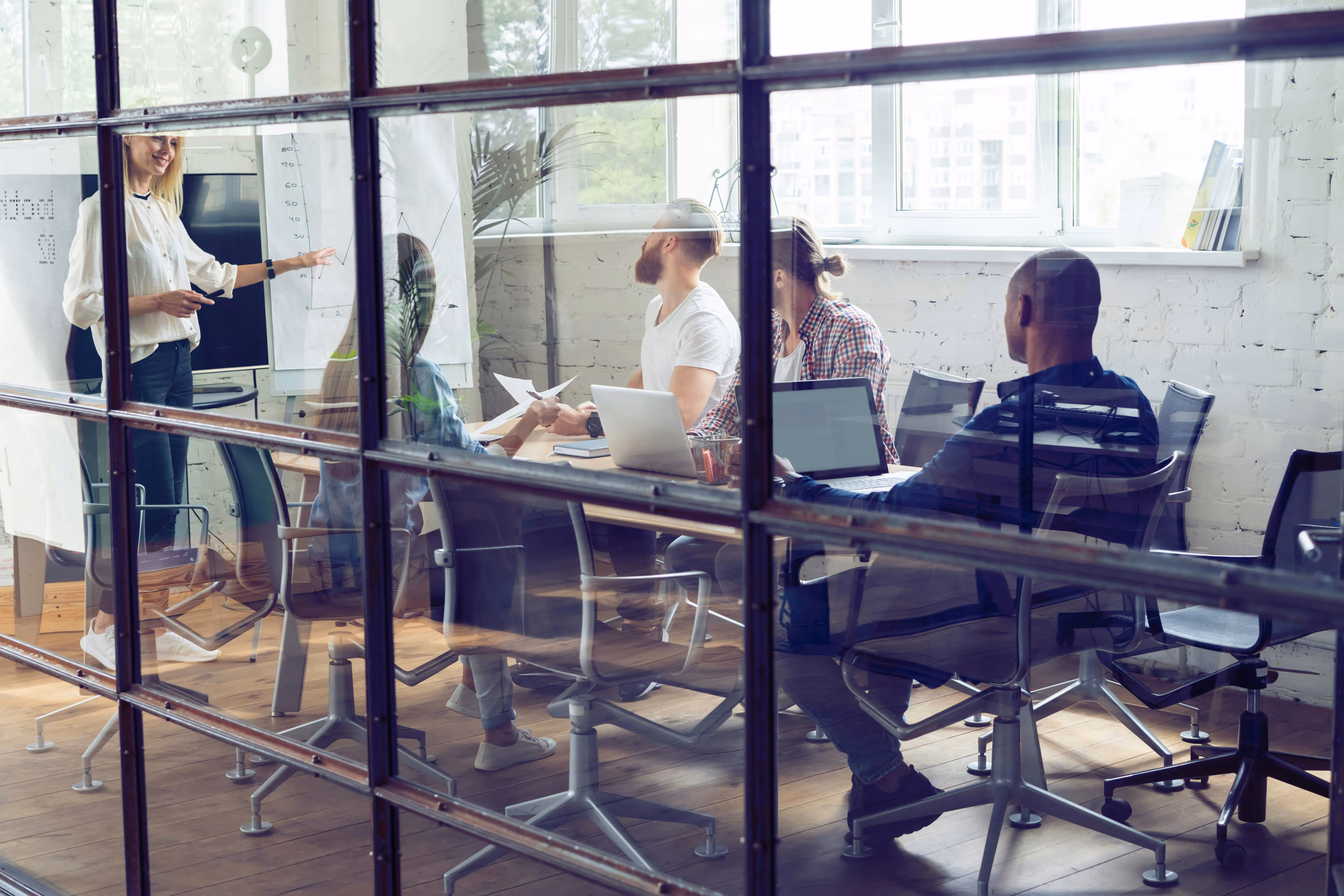 Team meeting in a modern office discussing business strategy.