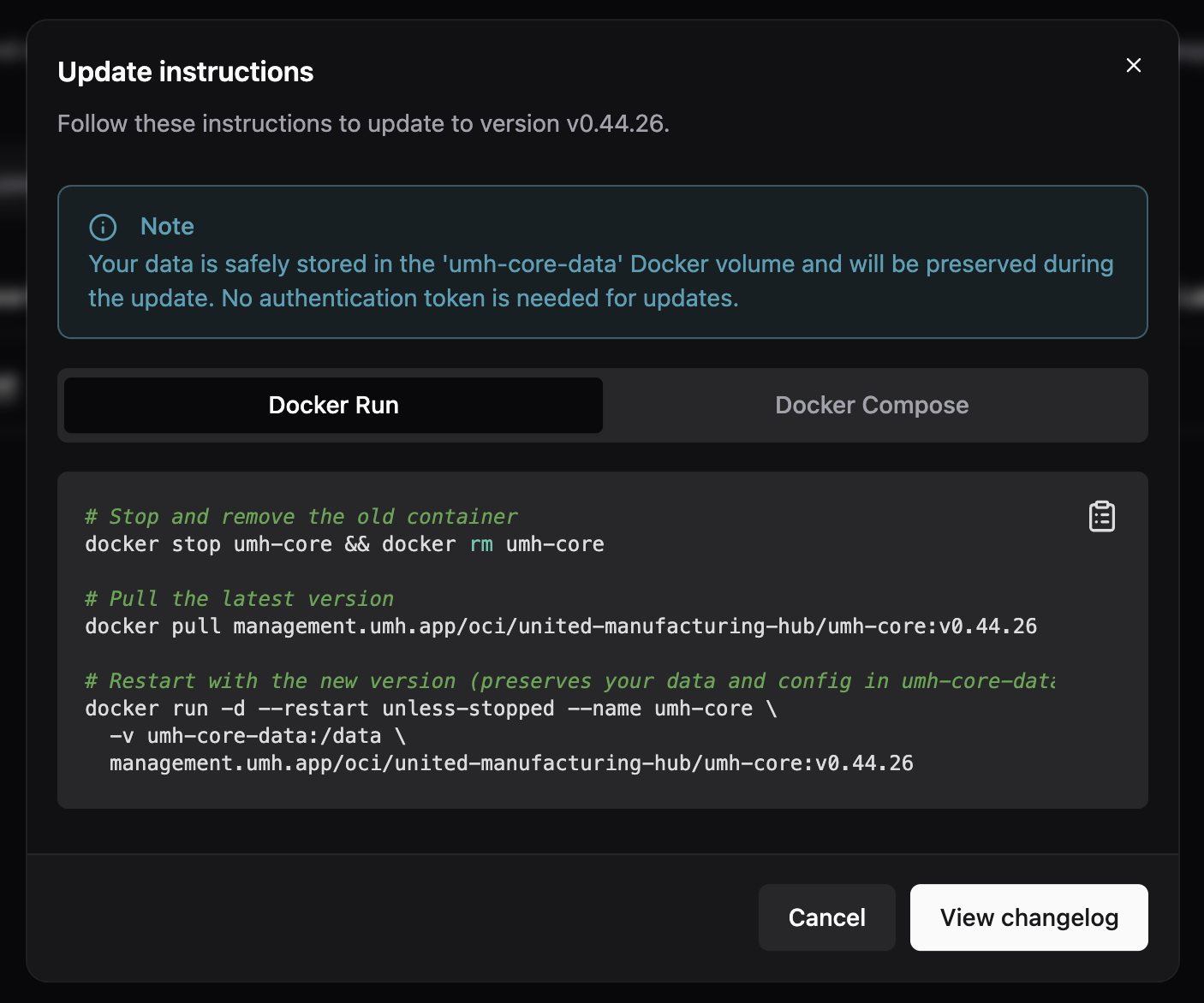 Update dialog for a UMH Core instance showing the Docker Run and Docker Compose tabs