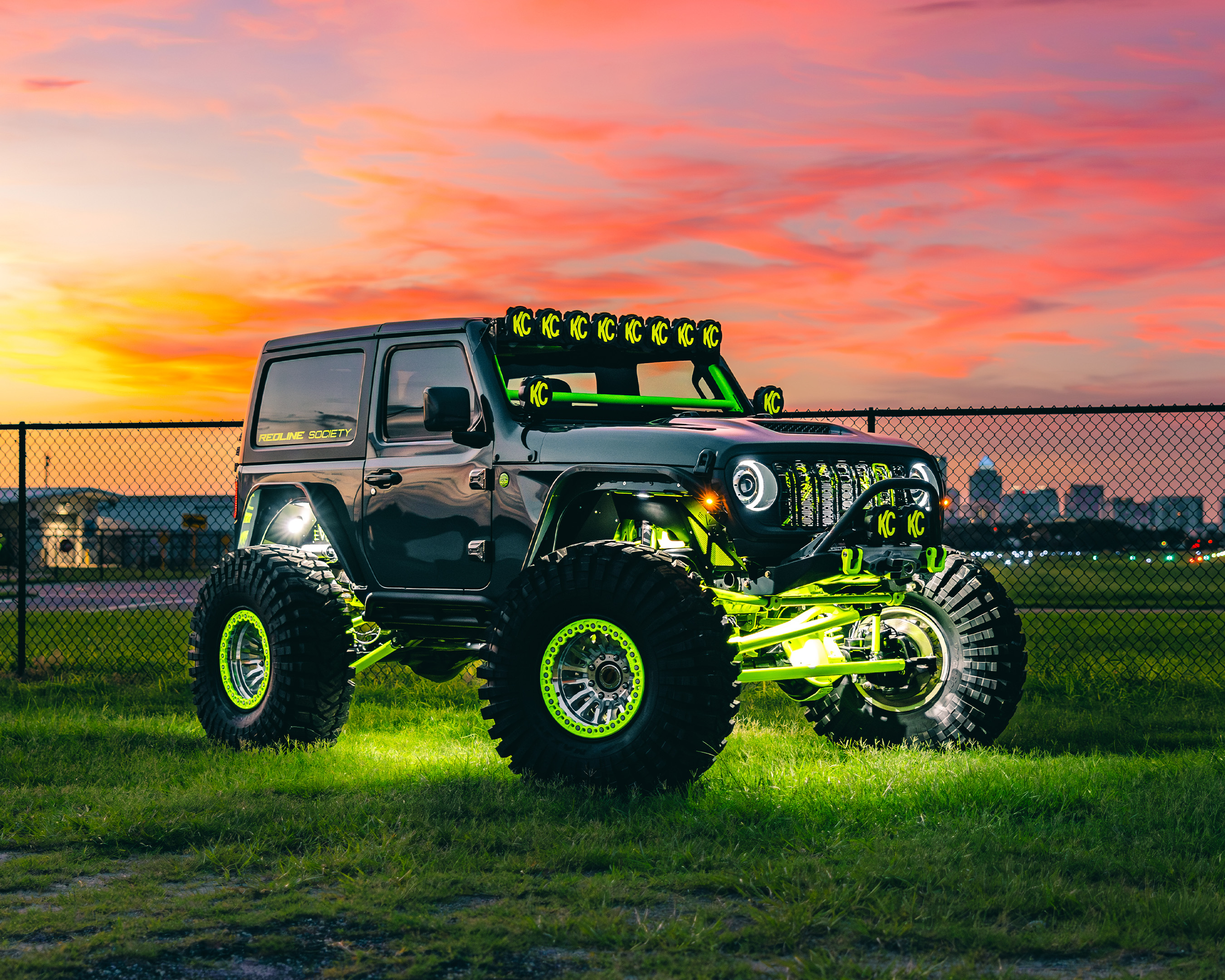 Custom wheels and tire installation on lifted truck at Redline Auto Creations