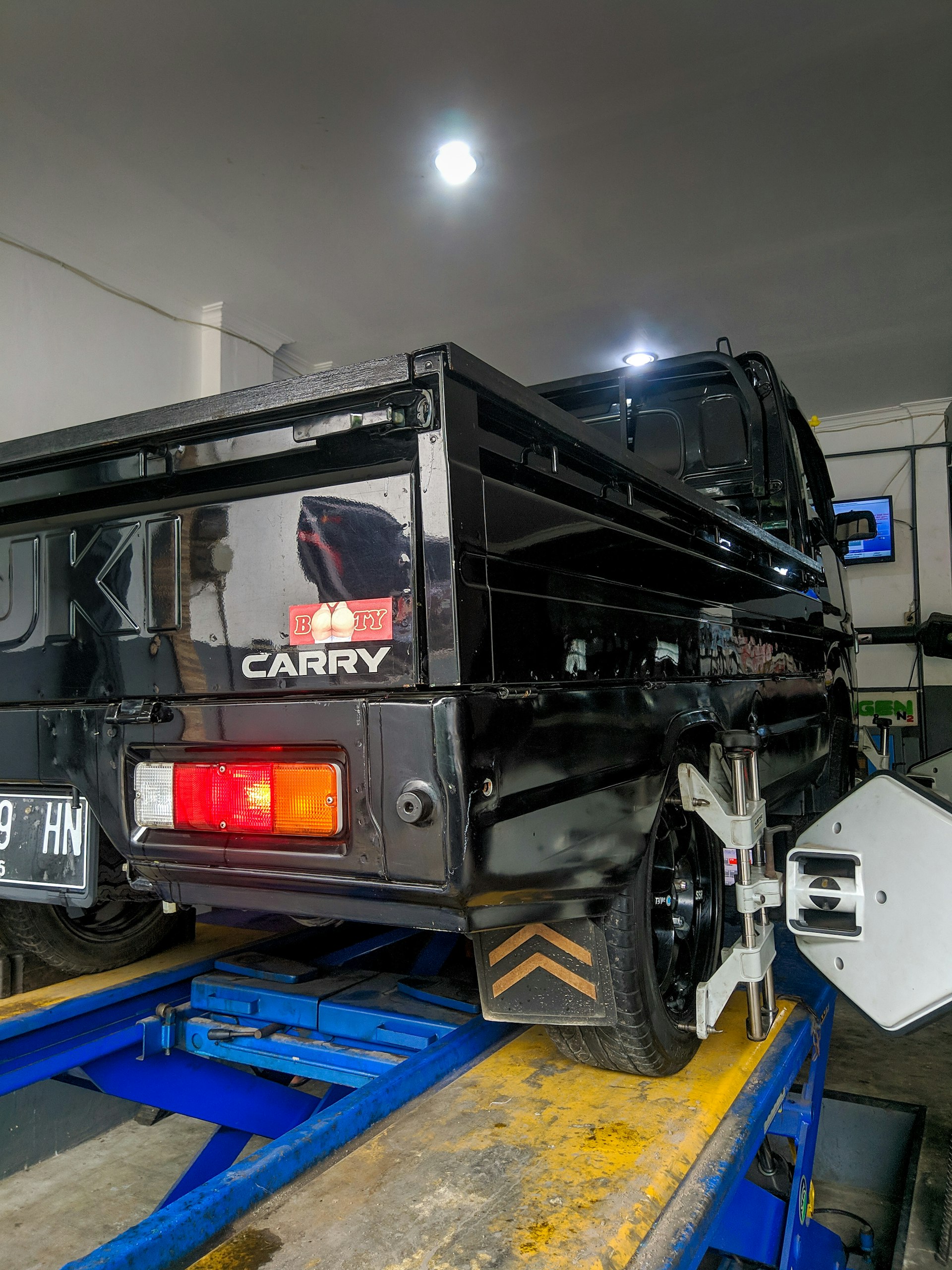 Truck getting alignment service in garage