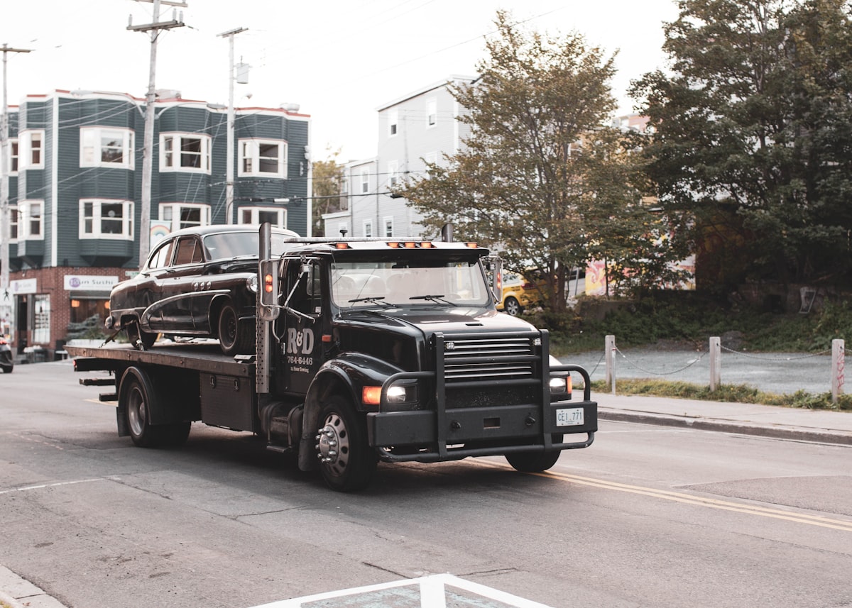 Black truck on road ready for cargo