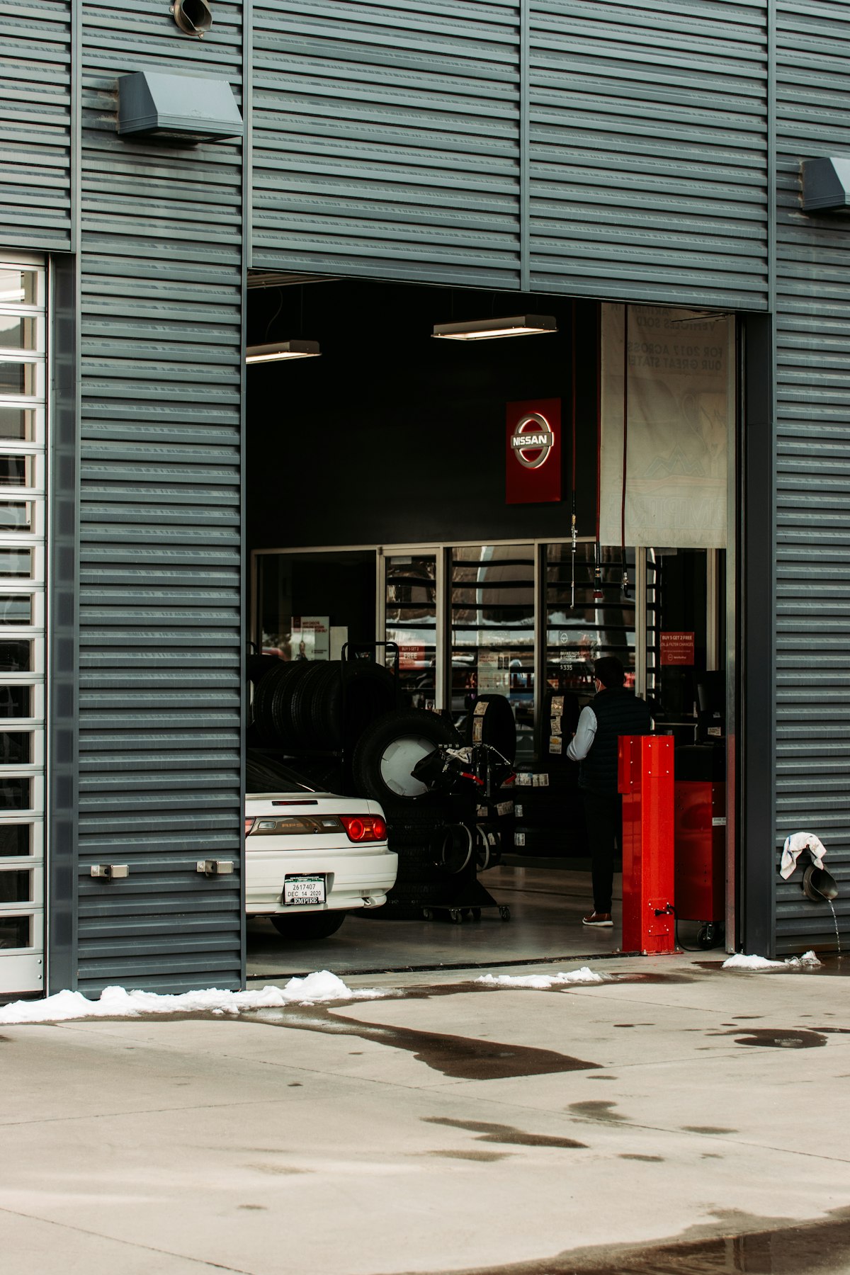 Professional auto shop front with vehicles parked outside