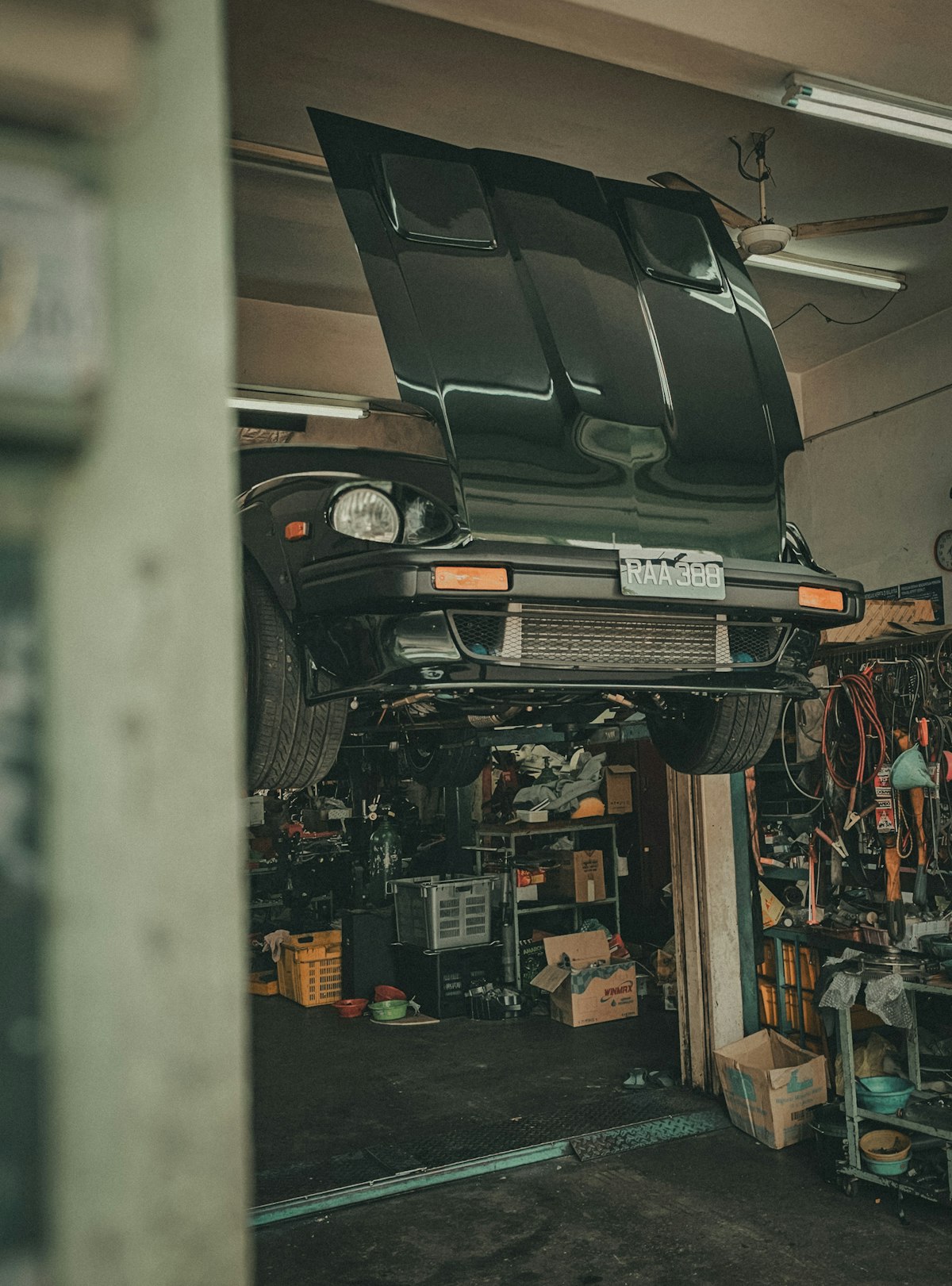 Vehicle on a lift in a professional garage