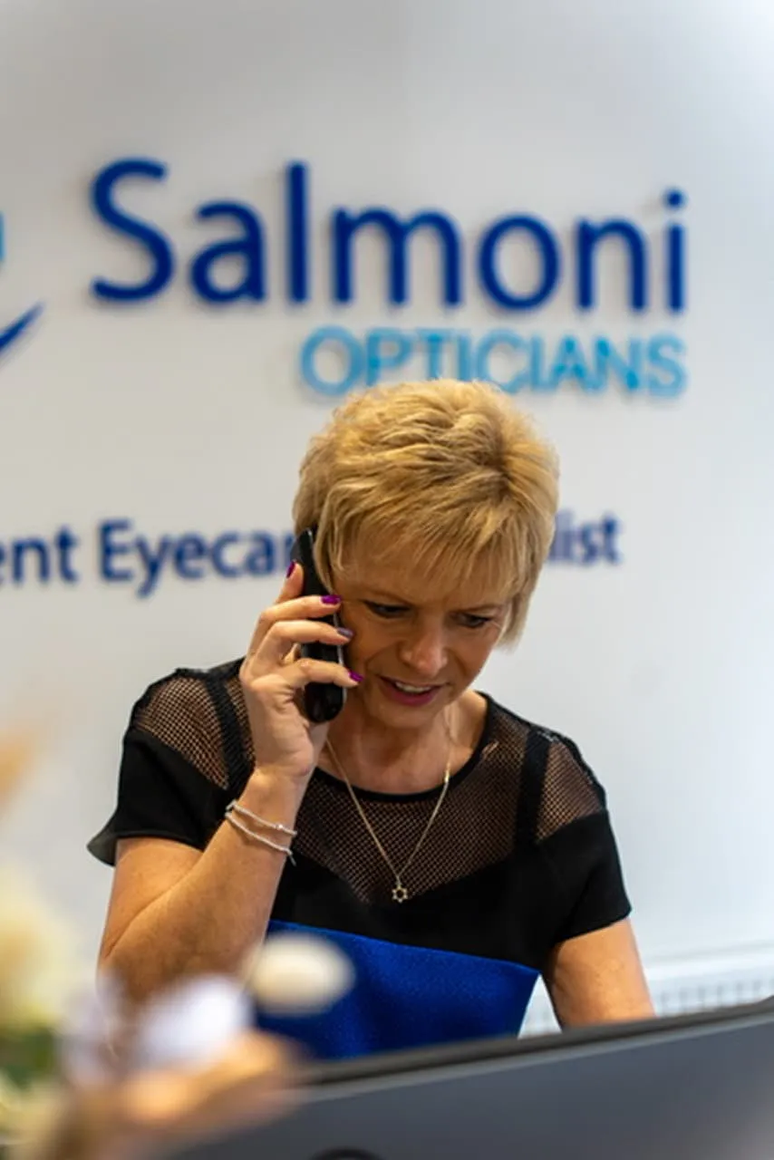 Salmoni Opticians staff member on phone