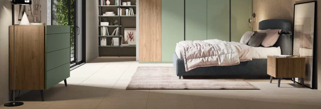 A modern bedroom with a bed, a nightstand, a dresser, and a bookshelf.