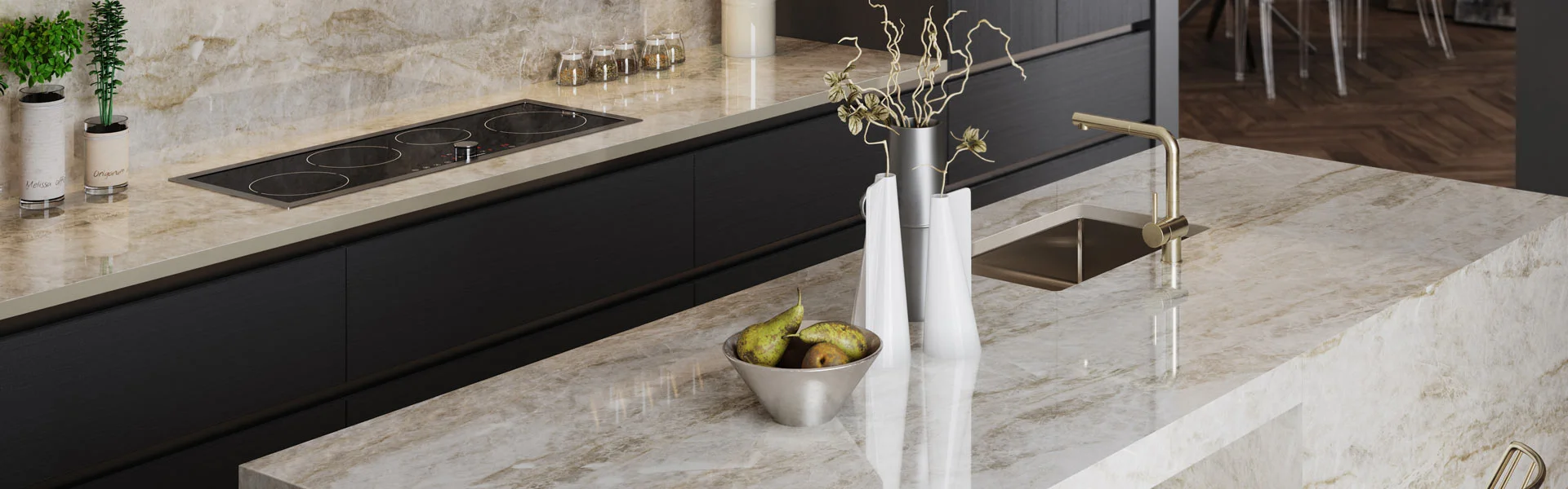 Modern kitchen counter with a marble surface, featuring a bowl of pears and a sleek faucet.