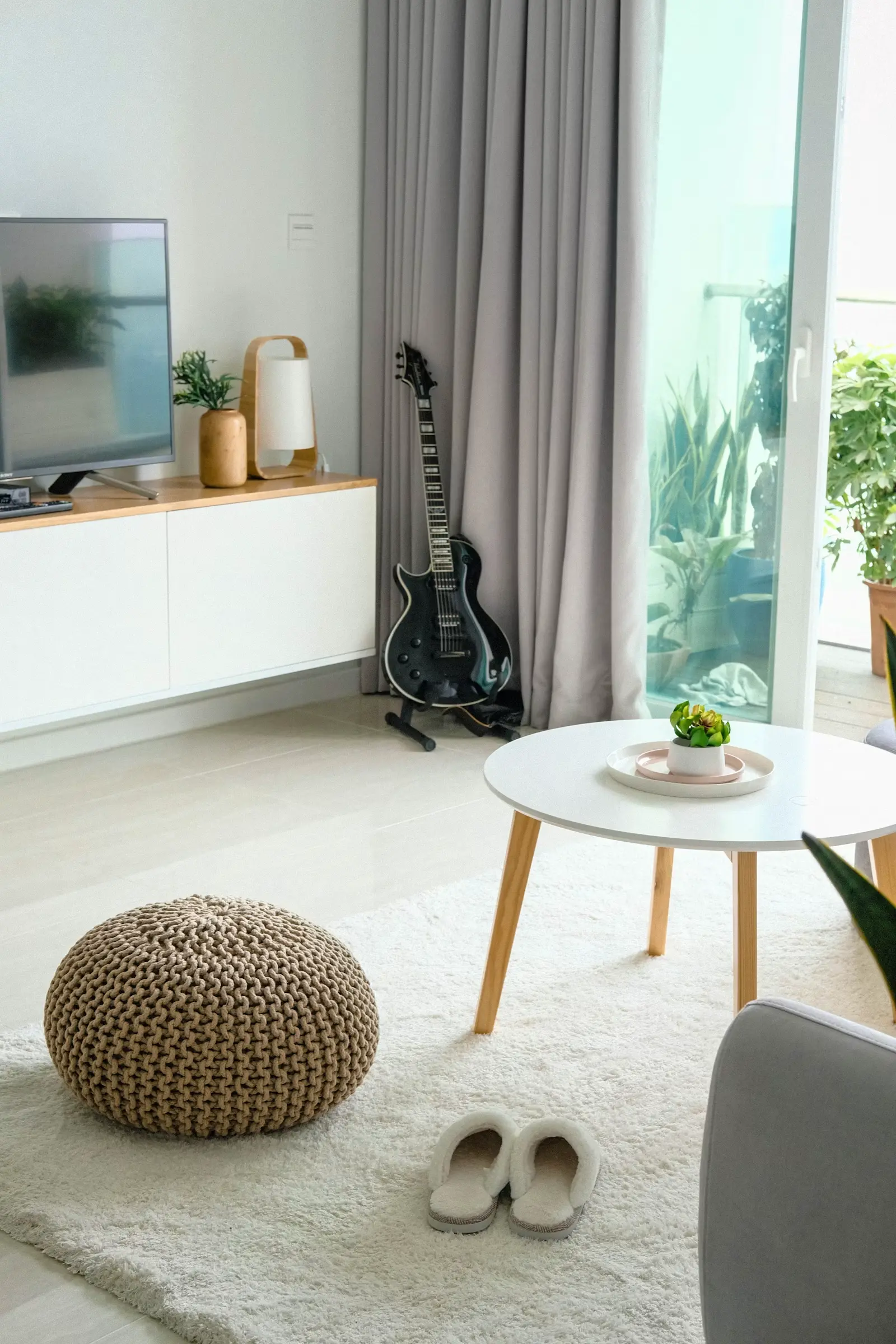 Furnished living room with green sofa and warm decor