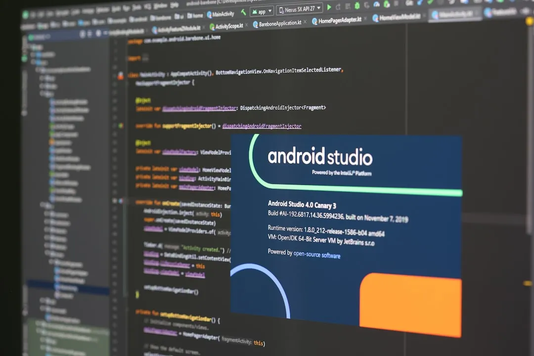 Developer's screen showing code and a mobile app preview - startup product development Developer's screen showing code and a mobile app preview - startup product development