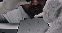 Craftsman inspecting an Atelier Luxus switch plated