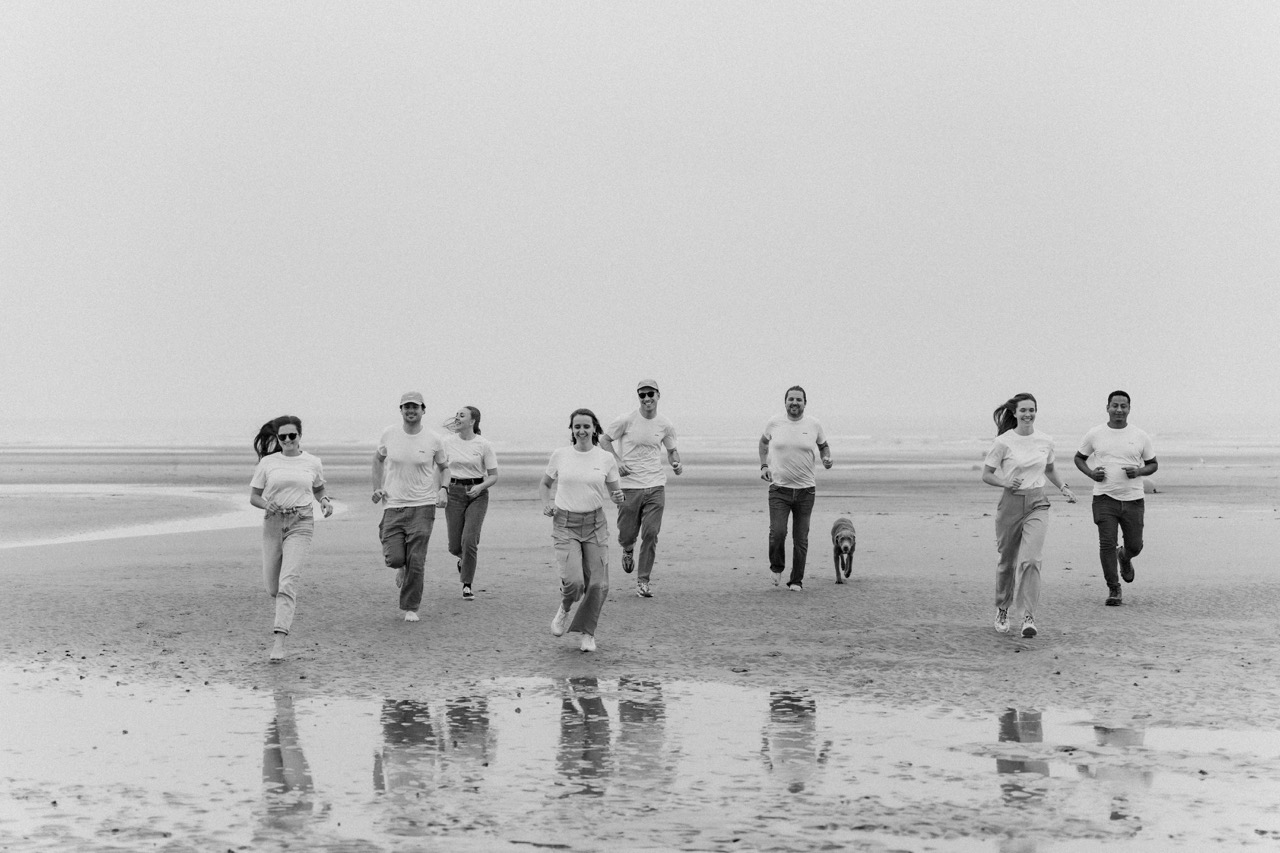 The Prado Family team running on the beach