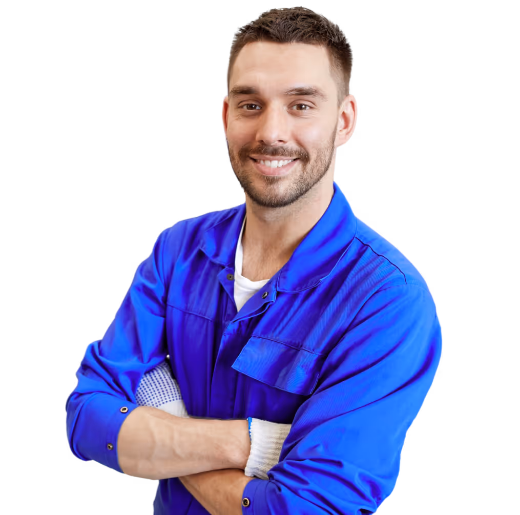 Smiling man wearing a blue work uniform with arms crossed, appearing confident and approachable.