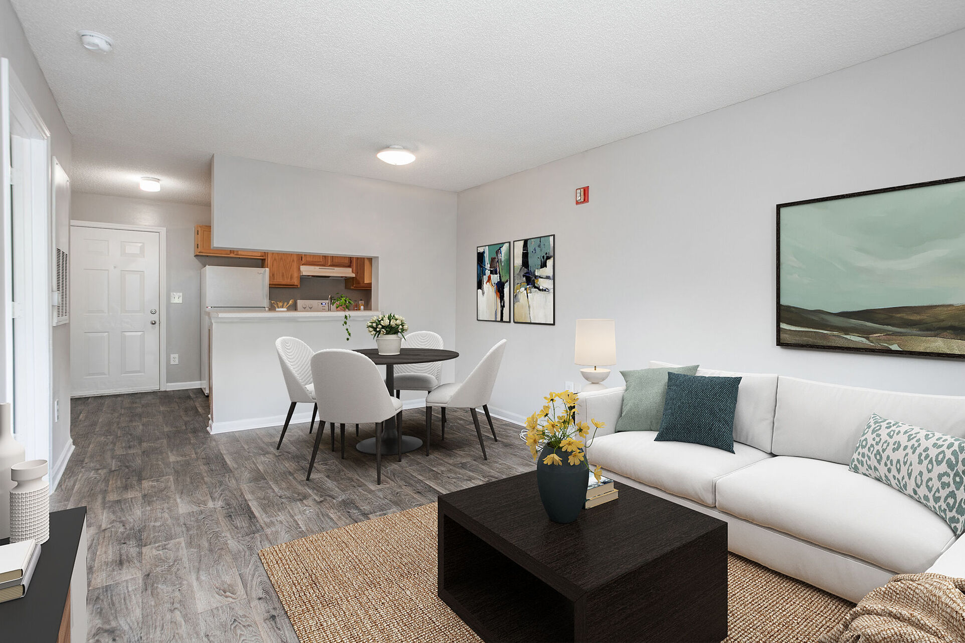 Virtually Staged dining and living area with sofa, table, and chairs