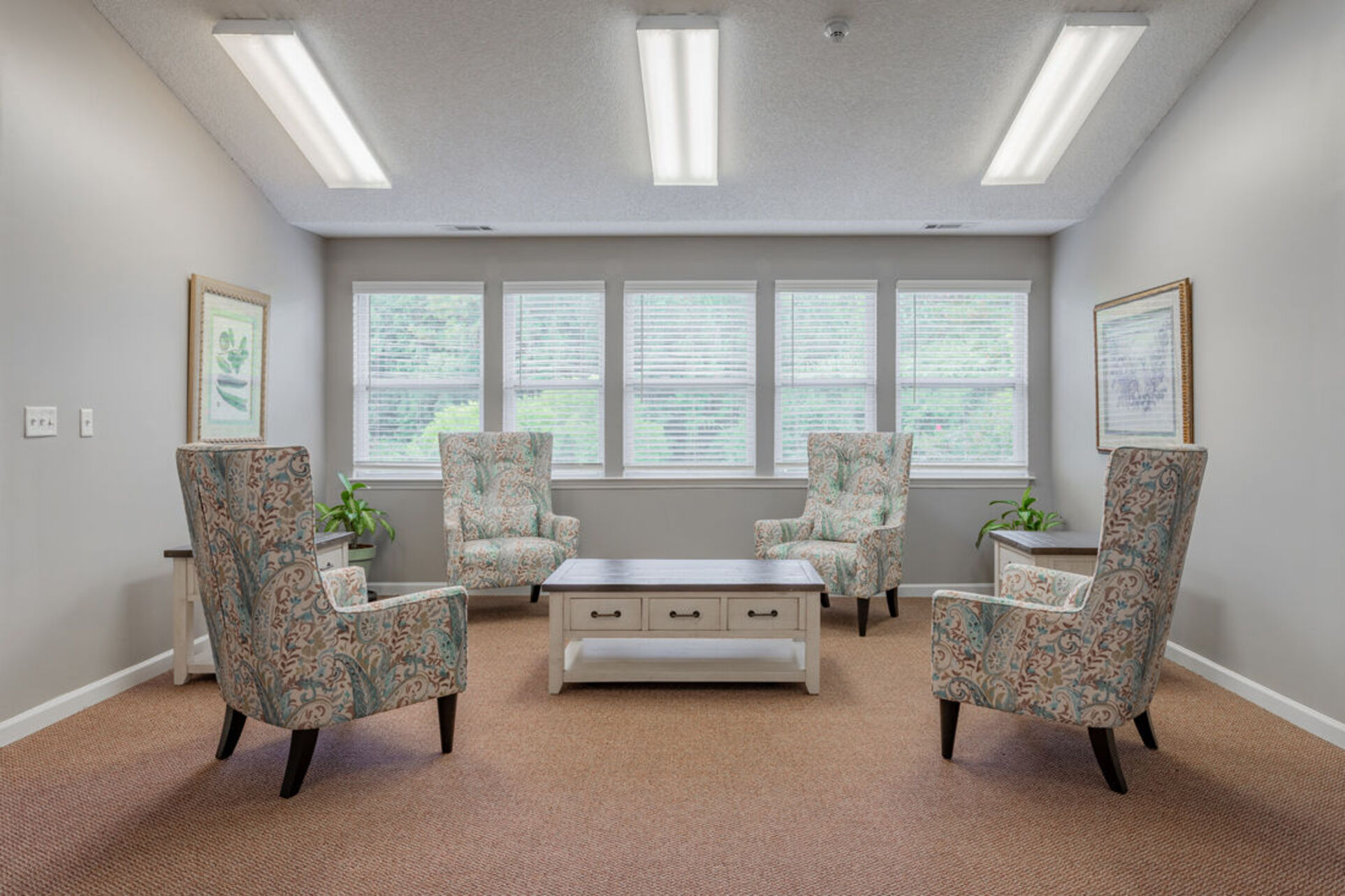 Community room with sofa and chairs