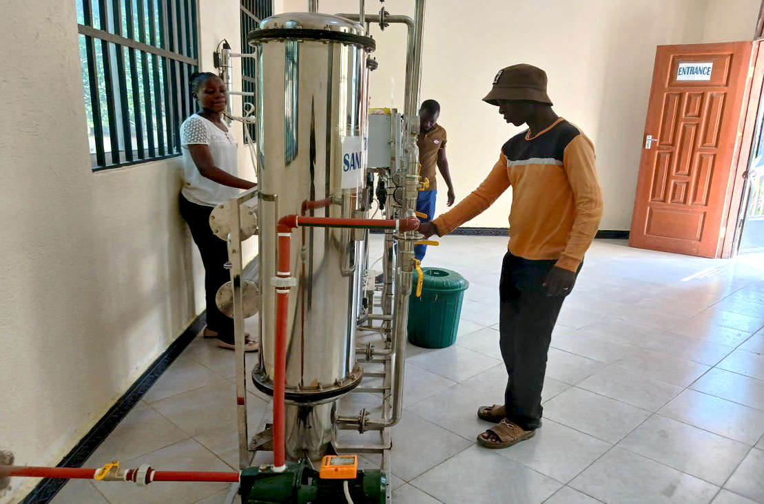 Staff at work operating the water filtration unit