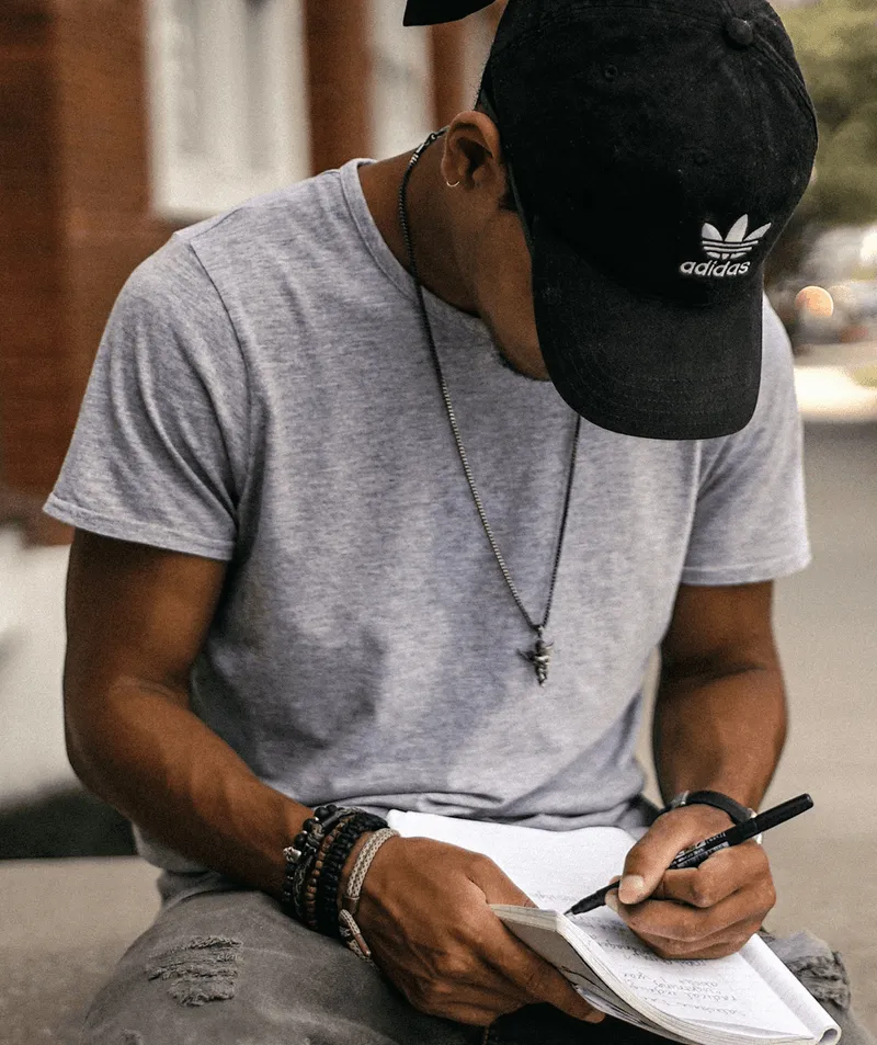 A student studying outside with a book