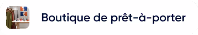 Étendoir rouge avec des vêtements suspendus devant un mur blanc.