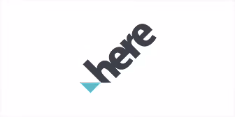 Logo avec le mot « here » en noir incliné avec un petit triangle bleu clair en dessous.