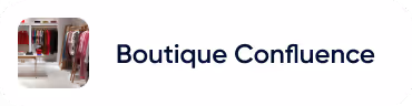 Intérieur d'une boutique avec des vêtements exposés, nommée Boutique Confluence.