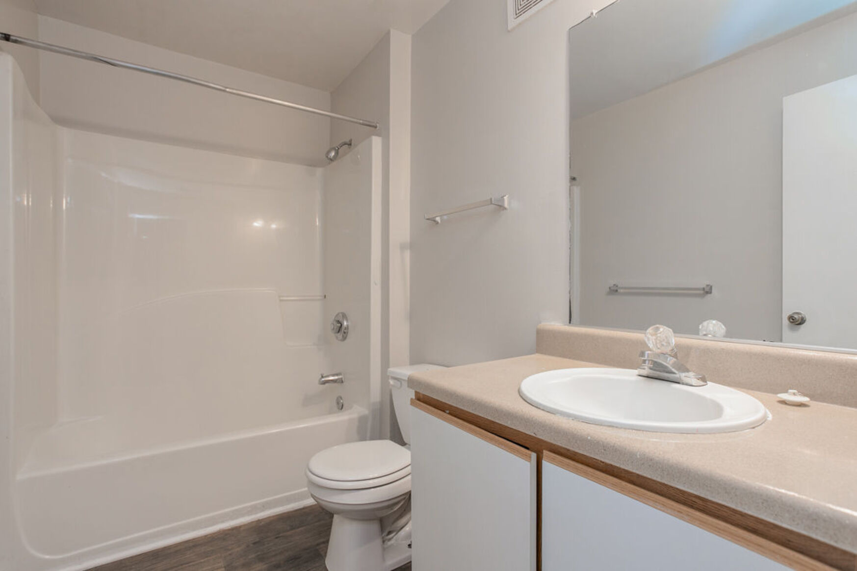 Bathroom with white and brown cabinets