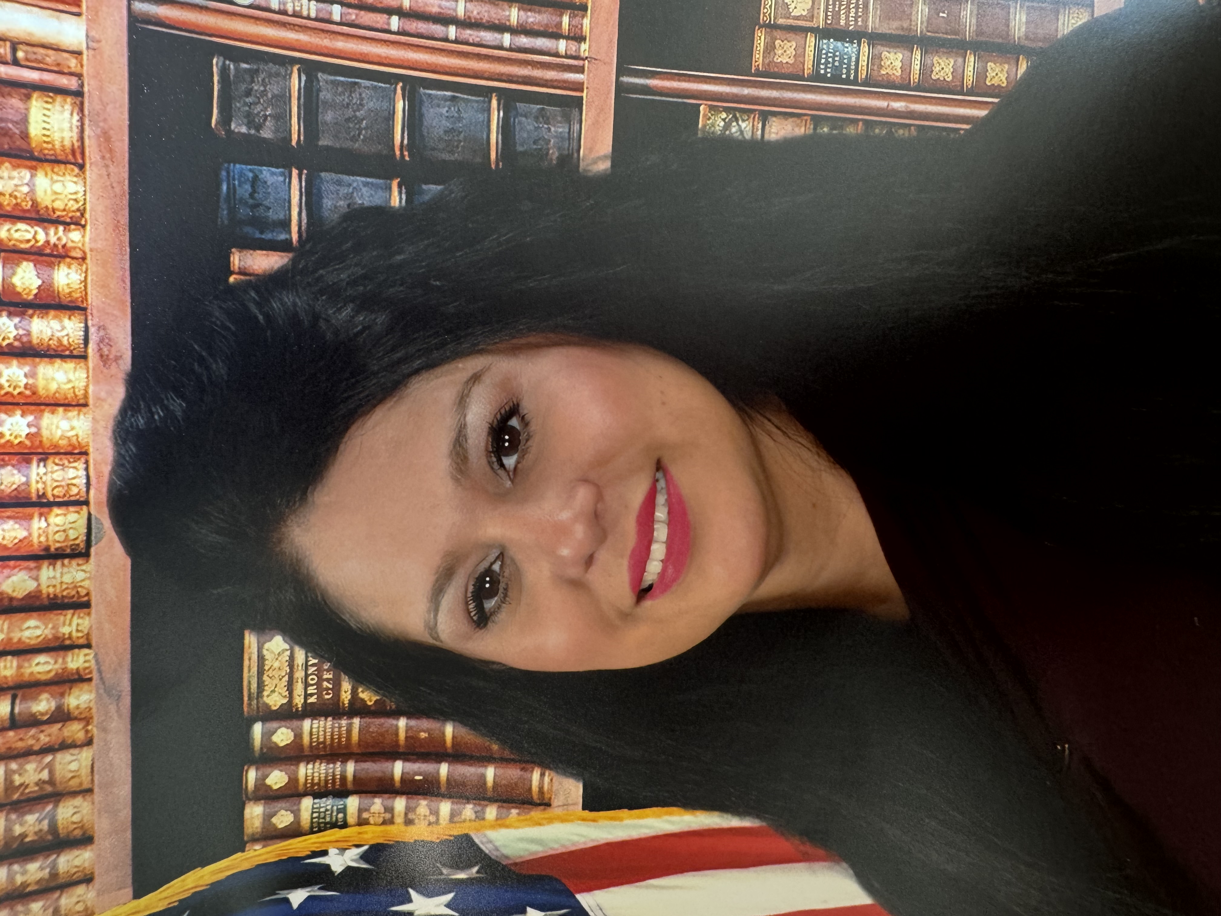 Jeanette Dippolito staff portrait with American flag