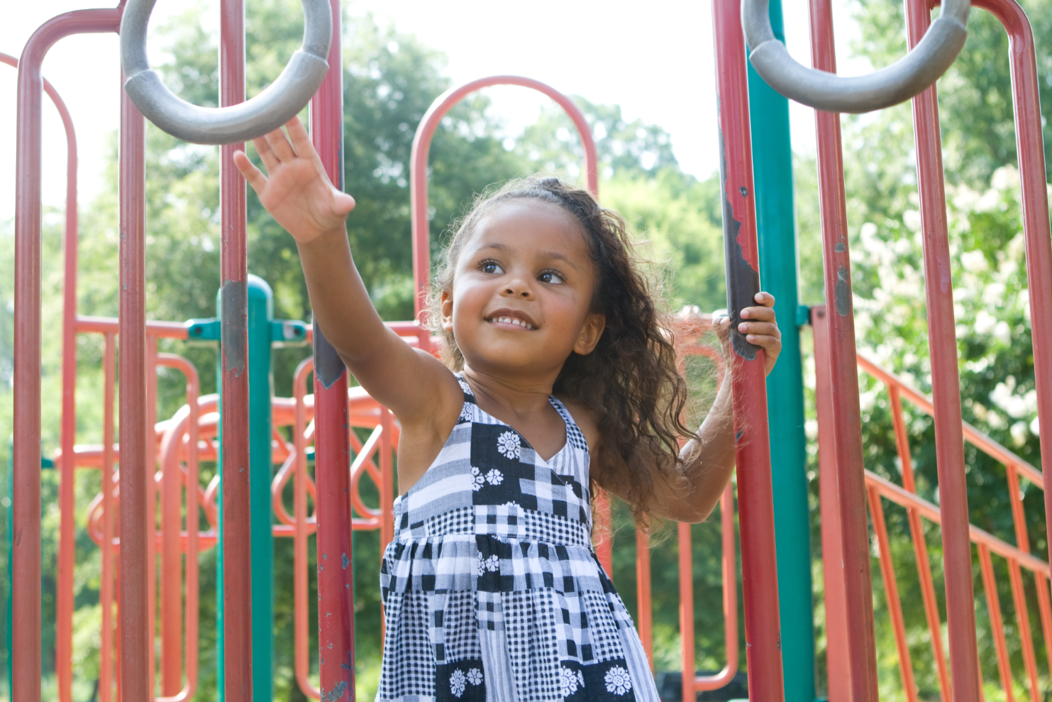 Little girl playing on playground stock image
