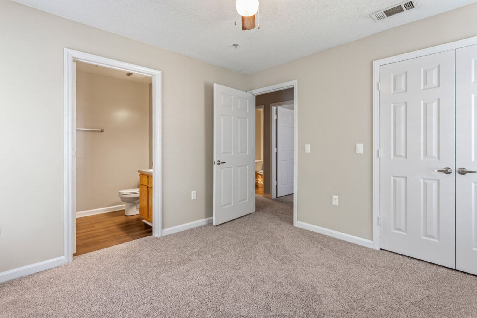 Empty bathroom with closet and bathroom