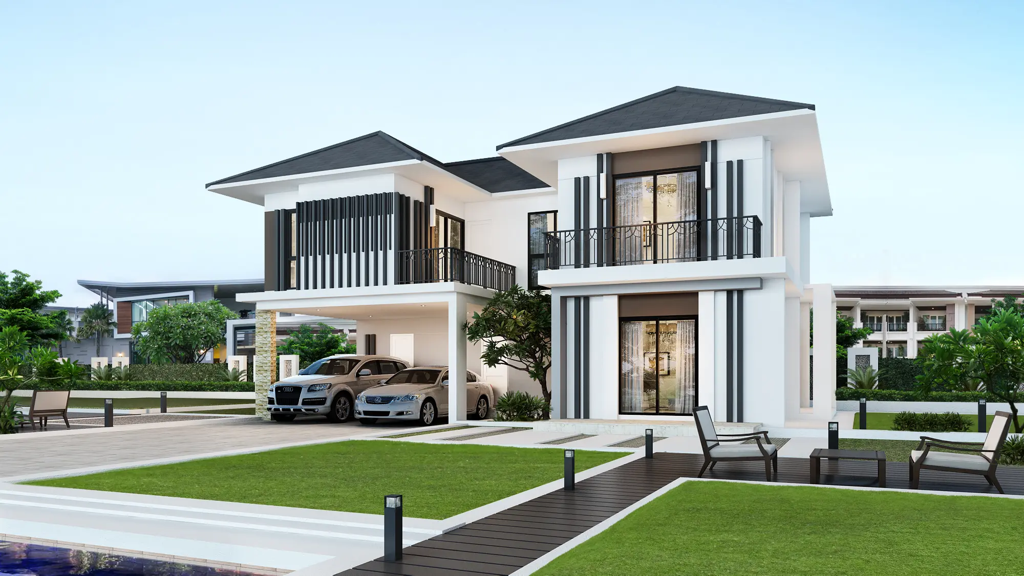 Modern two-story white house with black accents, two cars parked in the carport, and outdoor seating area on a wooden deck surrounded by green lawn.