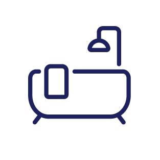 Icon of a bathtub with a towel hanging on its side and a showerhead above.