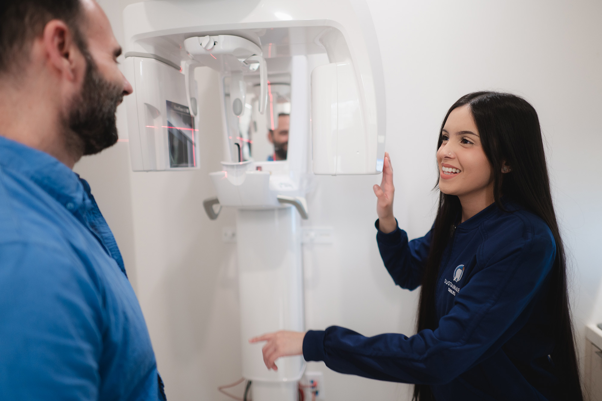 Our dental team explaining his tooth restoration options to a smiling patient