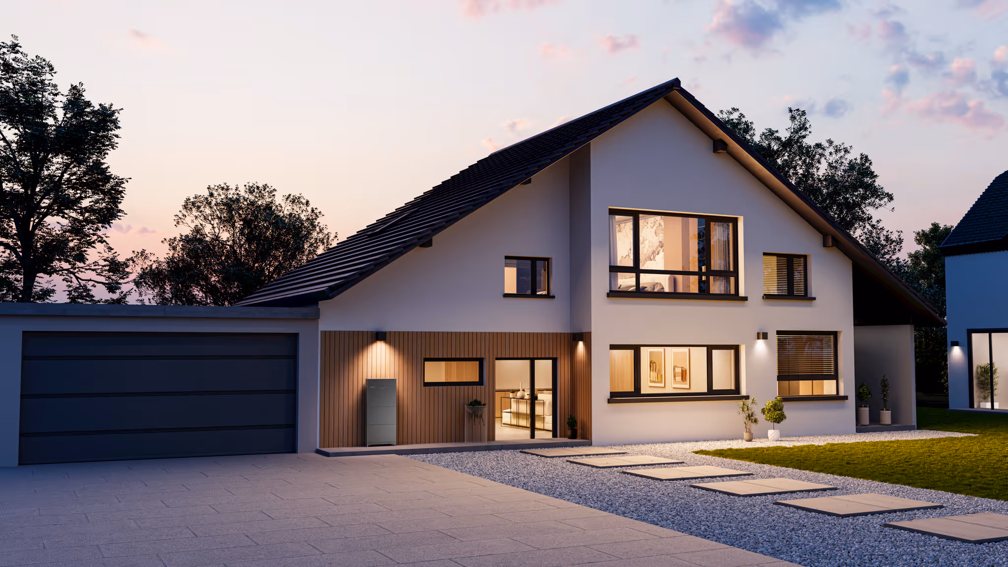 Modern two-story house at dusk with large windows, garage, and illuminated interior and exterior lights.