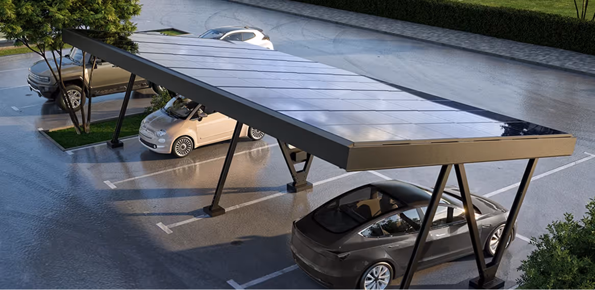 Parking area with a solar panel canopy covering three parked cars, surrounded by trees and pavement.