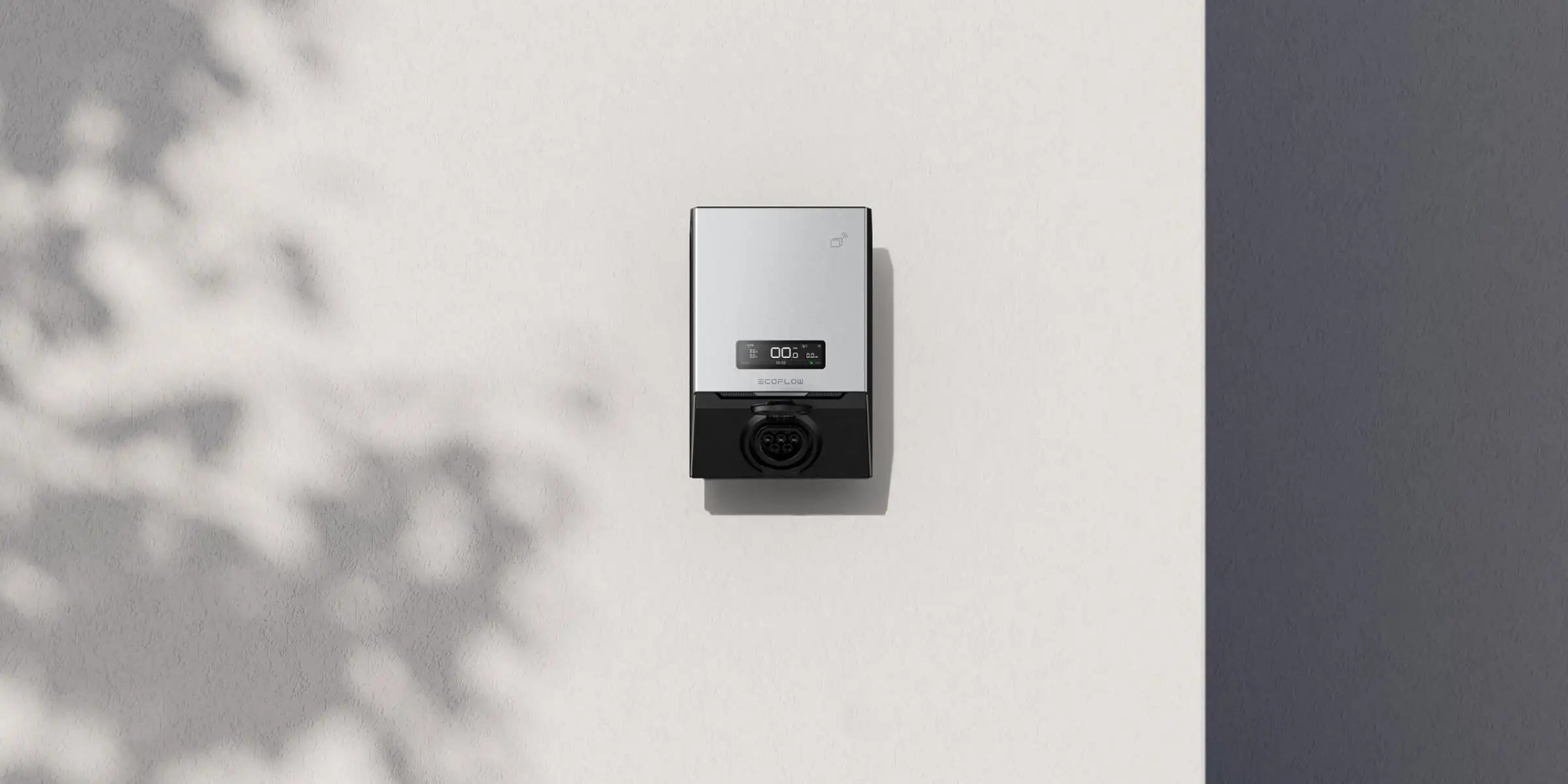 Wall-mounted EcoFlow electric vehicle charging station with digital display and charging port.