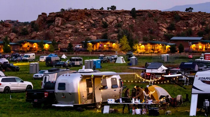Campers and RVs at the Fort Desolation campground at dusk