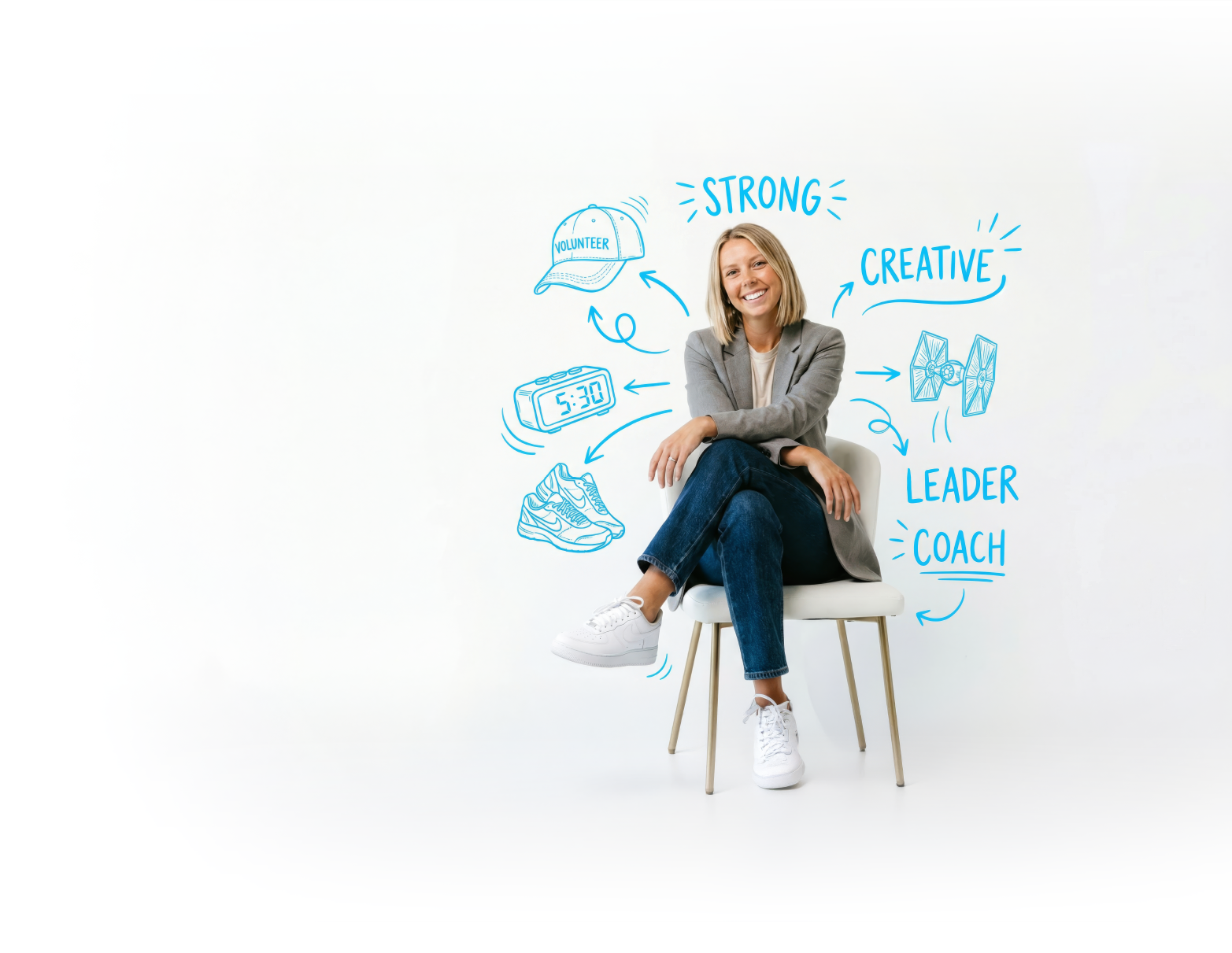 Smiling woman sitting on chair surrounded by blue doodles and words like strong, creative, leader, coach.