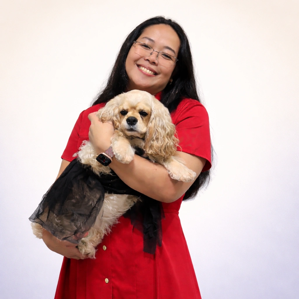 JC Adamos, founder and furparent of Furbly, with Ali the rescued American Cocker Spaniel whose care experience inspired the Furbaby app for furparents managing routines, medications, and pet health records
