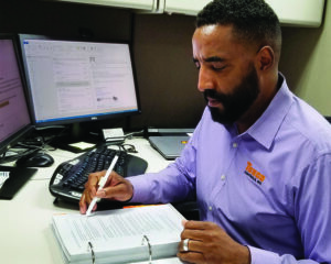 Project manager reviewing project files