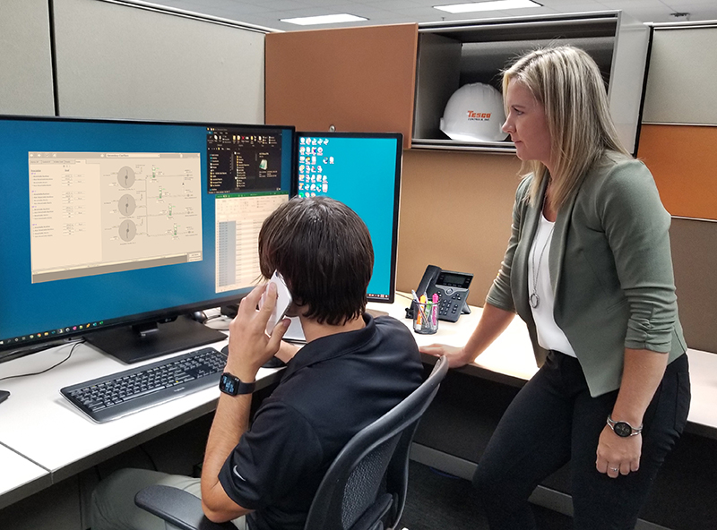 SCADA Engineer and Project Manager work with a client remotely.